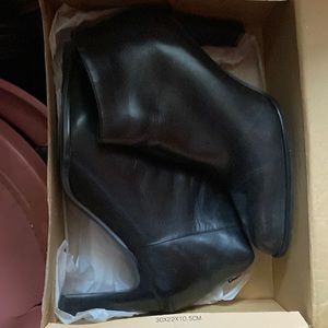 Cute black booties never worn , have slip guard still attached 8.5 woman’s